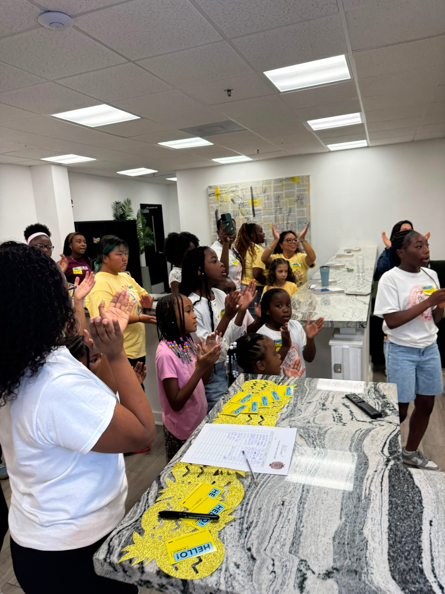 Girls worshipping with hands raised